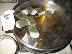 8 bags of green tea cooling for Kombucha scoby